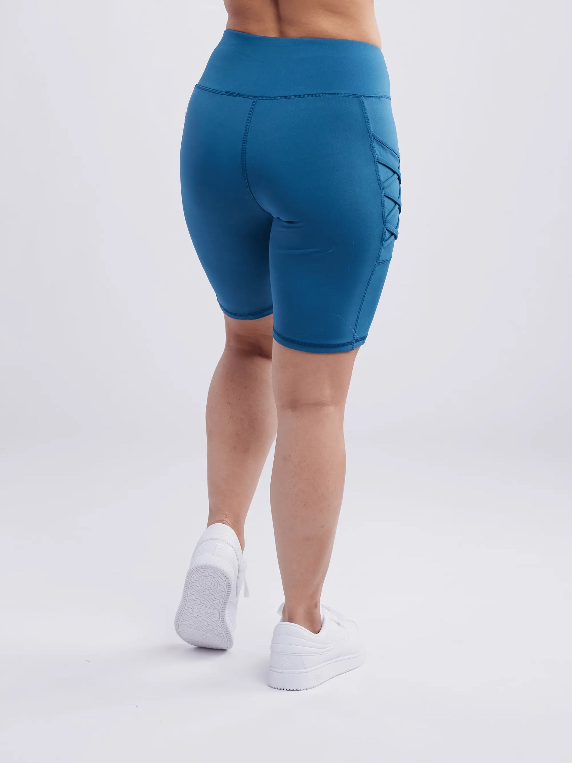 high waisted workout shorts with pockets and criss cross design